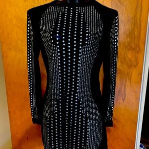 Black long sleeve sheer mini  party dress.  Never worn.